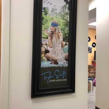 Smilebliss Orthodontics - Framed poster of Taylor Swift in Dr. Nirenblatt's clinic. - Orthodontists Near Me - North Charleston, South Carolina Smilebliss Orthodontics - Framed poster of Taylor Swift in Dr. Nirenblatt's clinic. - Orthodontists Near Me - North Charleston, South Carolina