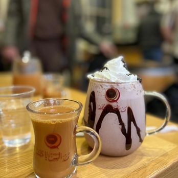 Qahwah House - a cup of coffee and a mug of milkshake - Coffee & Tea Near Me - Dearborn, Michigan Qahwah House - a cup of coffee and a mug of milkshake - Coffee & Tea Near Me - Dearborn, Michigan