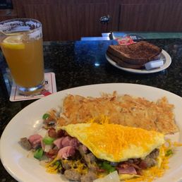 Very good omelet with special and hash browns but burnt toast.