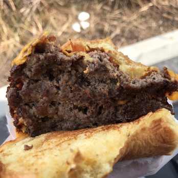 Shake Shack Pasadena - Missing pieces of meat with cheese oozing through the holes. - Burgers Near Me - Pasadena, California