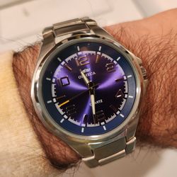 Kim's Gift Shop - new battery, repaired band... good as new.