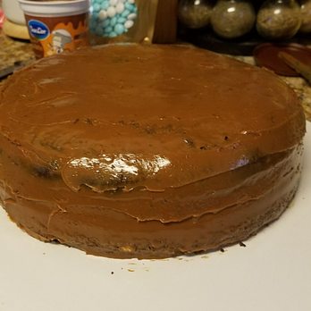 The Cake Palace by PC - a chocolate cake on a white plate - Custom Cakes Near Me