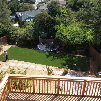 Artscapes - new deck, patio, turf and bonus trampoline area by Artscapes - Landscaping Near Me