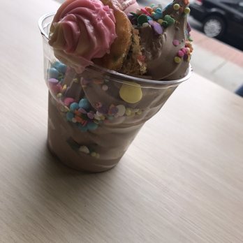 Churn Soft Serve - Another angle of the Unbirthday Sundae! Yumm! Comes with a mini cupcake, full size macaroon and an assortment of sprinkles. - Coffee & Tea Near Me - Buffalo, New York Churn Soft Serve - Another angle of the Unbirthday Sundae! Yumm! Comes with a mini cupcake, full size macaroon and an assortment of sprinkles. - Coffee & Tea Near Me - Buffalo, New York