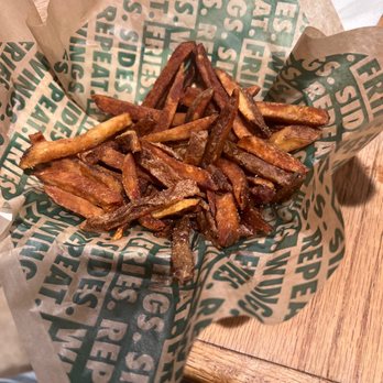 Wingstop - a basket of french fries on a table - Chicken Wings Near Me - Downey, California