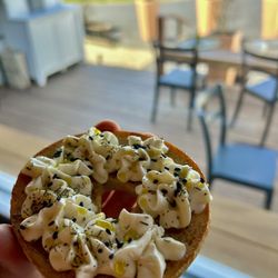 Arios Coffeehaus - Lemon-Ricotta cream cheese bagel, with evoo, thyme, and black sesame seeds