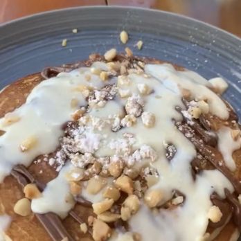Alaia - Mac nut pancakes with mac nut sauce, Nutella drizzle and actual Mac nuts. - Asian Fusion Near Me - Kahuku, Hawaii