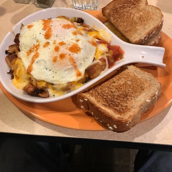 Scramblers - an orange plate with toast and eggs - Breakfast & Brunch Near Me - Powell, Ohio Scramblers - an orange plate with toast and eggs - Breakfast & Brunch Near Me - Powell, Ohio