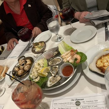 Tavern On the Hill - Some starters for the table - escargot, seafood starter, and the flambé cheese - Steakhouses Near Me - Enola, Pennsylvania Tavern On the Hill - Some starters for the table - escargot, seafood starter, and the flambé cheese - Steakhouses Near Me - Enola, Pennsylvania