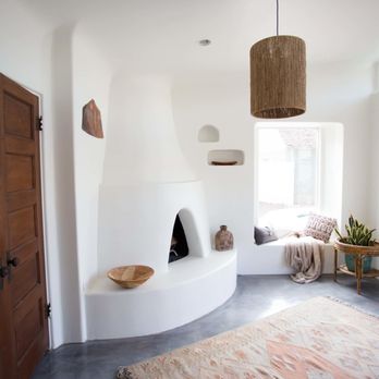AZ Contracting - a living room with a fireplace and a rug - General Contractors Near Me - Tempe, Arizona