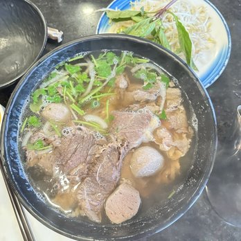 Pho Super Bowl - large house special, with rare steak, brisket, fatty flank, tendon, tripe and beef ball - Vietnamese Near Me - Coquitlam, British Columbia Pho Super Bowl - large house special, with rare steak, brisket, fatty flank, tendon, tripe and beef ball - Vietnamese Near Me - Coquitlam, British Columbia