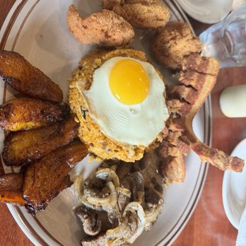 De Rican Chef - Oceanfront - Chicharron de cerdo m, arroz con gandules with a runny egg on top, fried sweet plantain marinated steak and fried crispy chicken. - Puerto Rican Near Me - Virginia Beach, Virginia De Rican Chef - Oceanfront - Chicharron de cerdo m, arroz con gandules with a runny egg on top, fried sweet plantain marinated steak and fried crispy chicken. - Puerto Rican Near Me - Virginia Beach, Virginia