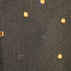 Dillard's - Various areas where the jewels popped off after one wear.