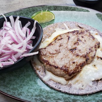 Descanso - This is allegedly supposed to be a rib eye steak taco.  I ordered toppings on the side. Pathetic taco - Mexican Near Me - Costa Mesa, California
