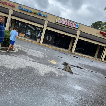 Las Terrazas Cuban Restaurant - a man and a boy walking in the rain - Cuban Near Me - Lawrenceville, Georgia Las Terrazas Cuban Restaurant - a man and a boy walking in the rain - Cuban Near Me - Lawrenceville, Georgia