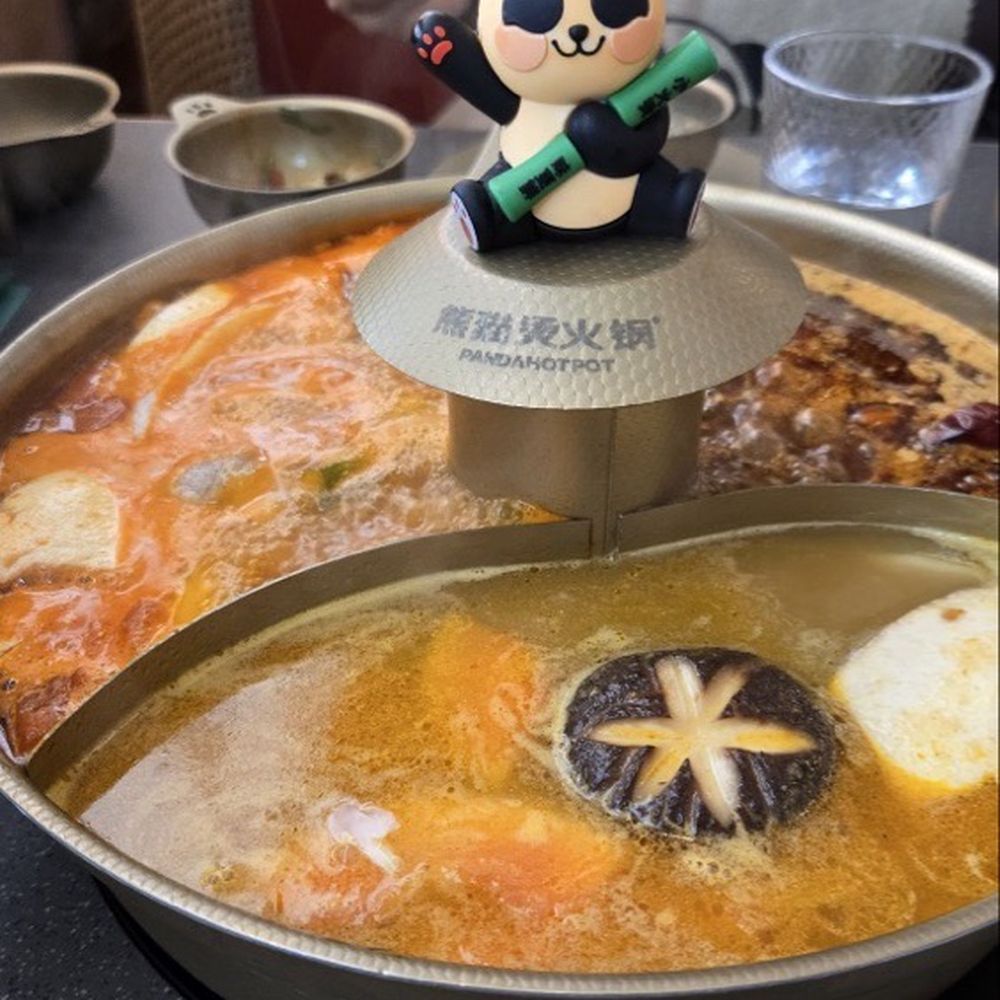 Nanshan Hot Pot - Triflavor hot pot. From left to right: tomato broth, fruit, and spicy house special - Hot Pot Near Me - Flushing, New York Nanshan Hot Pot - Triflavor hot pot. From left to right: tomato broth, fruit, and spicy house special - Hot Pot Near Me - Flushing, New York