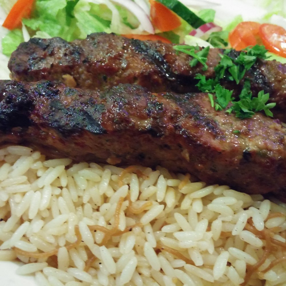 Flame Kabob - kofte kabab - with rice, house salad. also comes with garlic sauce and tzatziki sauce (not pictured) - Middle Eastern Near Me - Orlando, Florida Flame Kabob - kofte kabab - with rice, house salad. also comes with garlic sauce and tzatziki sauce (not pictured) - Middle Eastern Near Me - Orlando, Florida