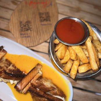 Mamey - Miami - Brie grilled cheese(passion fruit sauce below) + fries (ketchup has manago/passion fruit in it) - Cocktail Bars Near Me - Coral Gables, Florida Mamey - Miami - Brie grilled cheese(passion fruit sauce below) + fries (ketchup has manago/passion fruit in it) - Cocktail Bars Near Me - Coral Gables, Florida