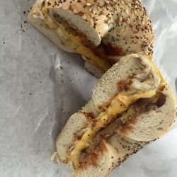 Holbrook Market Place & Delicatessen - Sausage, Egg, and Cheese on an Everything Bagel with Salt, Pepper, Ketchup.