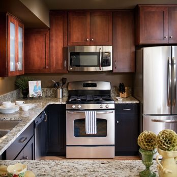 Cabinet Factory Outlet Plus - Two Tone Kitchen with Koch Cabinets, Brandy and Java finish with stainless range and microwave vent. - Cabinetry Near Me - Omaha, Nebraska Cabinet Factory Outlet Plus - Two Tone Kitchen with Koch Cabinets, Brandy and Java finish with stainless range and microwave vent. - Cabinetry Near Me - Omaha, Nebraska