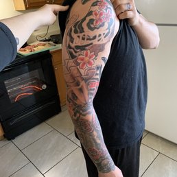 Koi fish with Roman numerals and flowers.