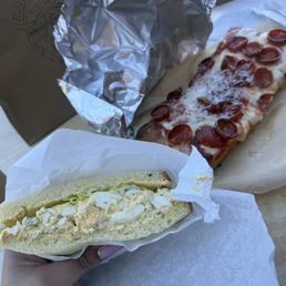 Egg salad sandwich and pepperoni pizza Egg salad sandwich and pepperoni pizza