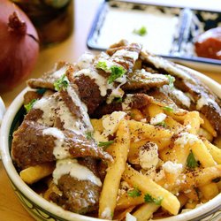 Space City Pizza - Try our Gyro fries, topped with tender Gyro strips and a hint of parsley and white sauce.