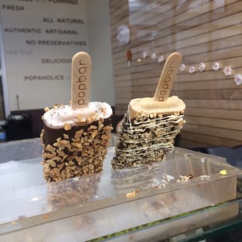 Popbar - Left - strawberry gelato, full dark choc dip and waffle cone. Right - pb gelato with milk choc, nuts and white choc drizzle - Desserts Near Me - Anaheim, California