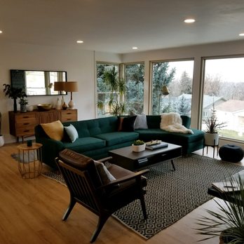 Factory Direct Flooring - a living room with a green couch - Flooring Near Me - Meridian, Idaho Factory Direct Flooring - a living room with a green couch - Flooring Near Me - Meridian, Idaho