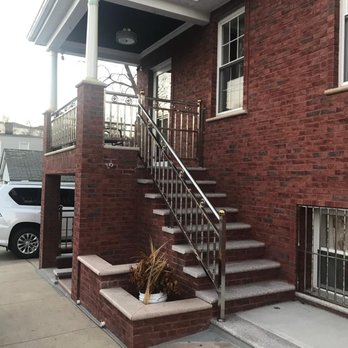 New York Brick Pointing - a brick building with stairs - General Contractors Near Me - Brooklyn, New York New York Brick Pointing - a brick building with stairs - General Contractors Near Me - Brooklyn, New York