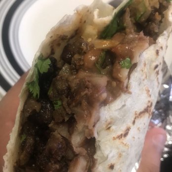 Sal-Mex Bakery - a hand holding a burrito - Bakeries Near Me - Salinas, California Sal-Mex Bakery - a hand holding a burrito - Bakeries Near Me - Salinas, California