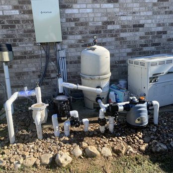 Skyline Pools - a water heater, a tank, and other equipment - Pool & Hot Tub Service Near Me Skyline Pools - a water heater, a tank, and other equipment - Pool & Hot Tub Service Near Me