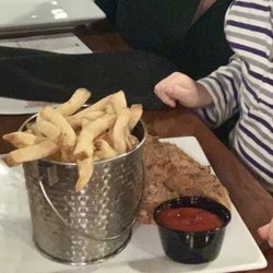 Station 343 Firehouse Restaurant - My child's home made chicken tenders with a bucket side of house fries. Tender and juicy white meat chicken with a mildly spiced breading.