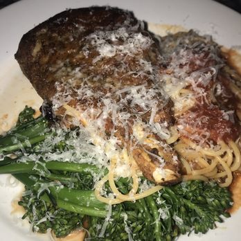 Mama Carolla's - Pork chop with spaghetti and broccolini - Italian Near Me - Indianapolis, Indiana Mama Carolla's - Pork chop with spaghetti and broccolini - Italian Near Me - Indianapolis, Indiana