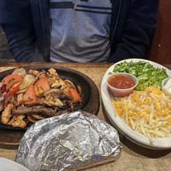Montgomery's Grill & Saloon - Fajitas, half and half: beef & chicken