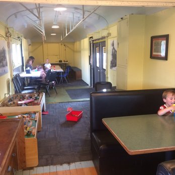 All Aboard Ice Cream - Inside train cart. With wooden train sets for kids to play with, coloring table, tv. - Ice Cream & Frozen Yogurt Near Me - Joplin, Missouri All Aboard Ice Cream - Inside train cart. With wooden train sets for kids to play with, coloring table, tv. - Ice Cream & Frozen Yogurt Near Me - Joplin, Missouri