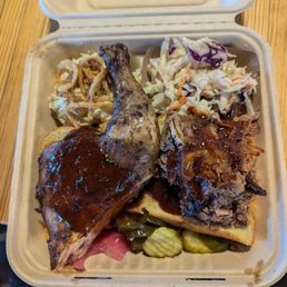 Dark meat chicken, pulled pork, potato salad and cole slaw Dark meat chicken, pulled pork, potato salad and cole slaw