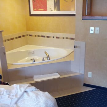 Courtyard Kansas City Shawnee - The tub next to the king-size bed, in a "king spa suite." - Hotels Near Me - Shawnee, Kansas Courtyard Kansas City Shawnee - The tub next to the king-size bed, in a "king spa suite." - Hotels Near Me - Shawnee, Kansas
