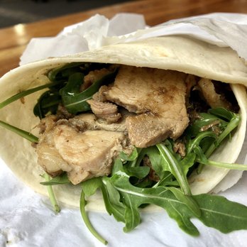 Roast Hog - Portuguese porchetta wrap with an apple sauce and rocket greens. Flavorsome, seasoned, and porky. So incredibly tasty. - Portuguese Near Me - London, XGL Roast Hog - Portuguese porchetta wrap with an apple sauce and rocket greens. Flavorsome, seasoned, and porky. So incredibly tasty. - Portuguese Near Me - London, XGL
