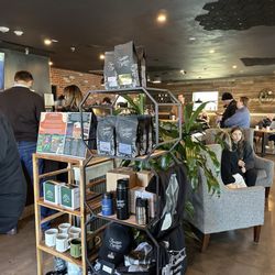 1418 Coffee - A variety of merch is available for purchase.