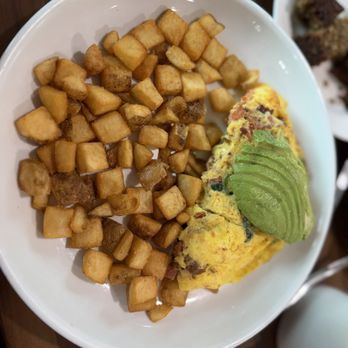 Blockhouse - Customize your omelette any way you want. This one has spinach, tomatoes, bacon, goat cheese and topped with avocado! - Breakfast & Brunch Near Me - Saint Hedwig, Texas Blockhouse - Customize your omelette any way you want. This one has spinach, tomatoes, bacon, goat cheese and topped with avocado! - Breakfast & Brunch Near Me - Saint Hedwig, Texas