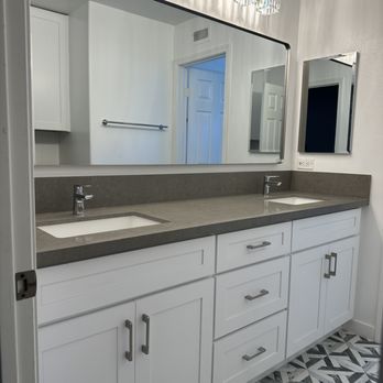 Orange Kitchen & Bath - a bathroom with two sinks and a large mirror - General Contractors Near Me - Orange, California Orange Kitchen & Bath - a bathroom with two sinks and a large mirror - General Contractors Near Me - Orange, California