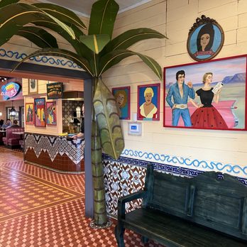 Chuy's - Here is the nice lobby area near the entrance. Is that Elvis in the print on the wall??? - Tex-Mex Near Me - Jacksonville, Florida