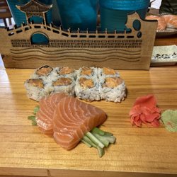 Fuji Sushi - Two pieces of salmon sashimi and a spicy salmon roll.