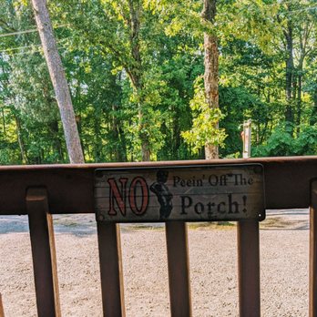 Mountain Outpost - a wooden bench with a no parking sign on it - Delis Near Me - Morrilton, Arkansas Mountain Outpost - a wooden bench with a no parking sign on it - Delis Near Me - Morrilton, Arkansas