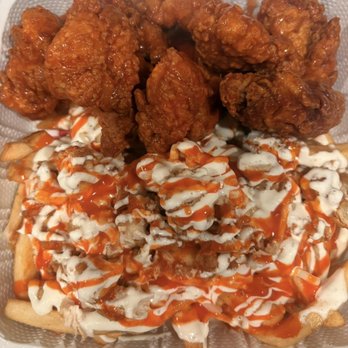 Rocki's Chicken - 10 Boneless wing combo tossed in buffalo with buffalo loaded fries - Chicken Wings Near Me - Carmichael, California Rocki's Chicken - 10 Boneless wing combo tossed in buffalo with buffalo loaded fries - Chicken Wings Near Me - Carmichael, California