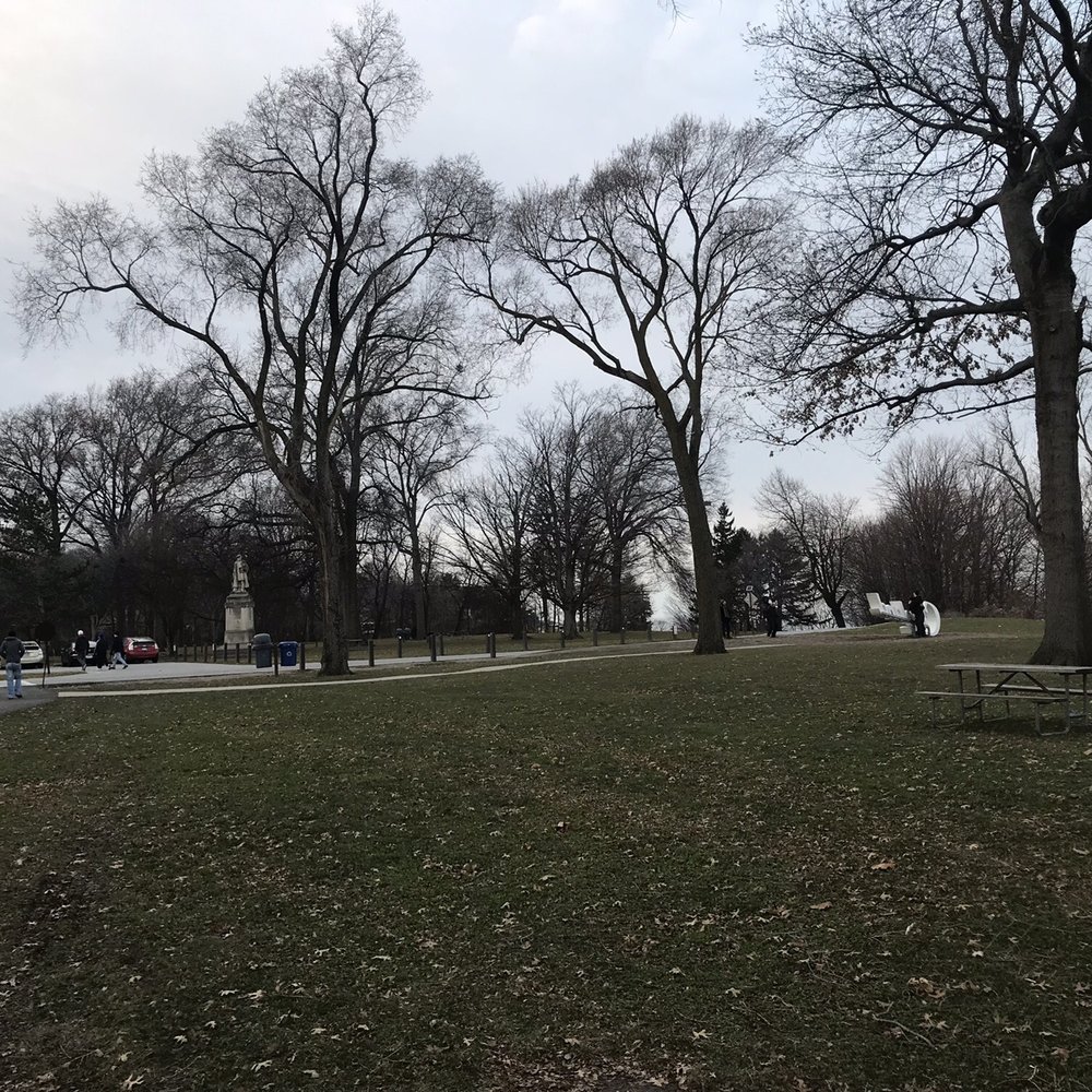 Edgewater Park - Where the "Cleveland" sign is located. Statue of Richard Wagner on left behind trash cans. "Cleveland" sign on right with people standing. - Parks Near Me - Cleveland, Ohio