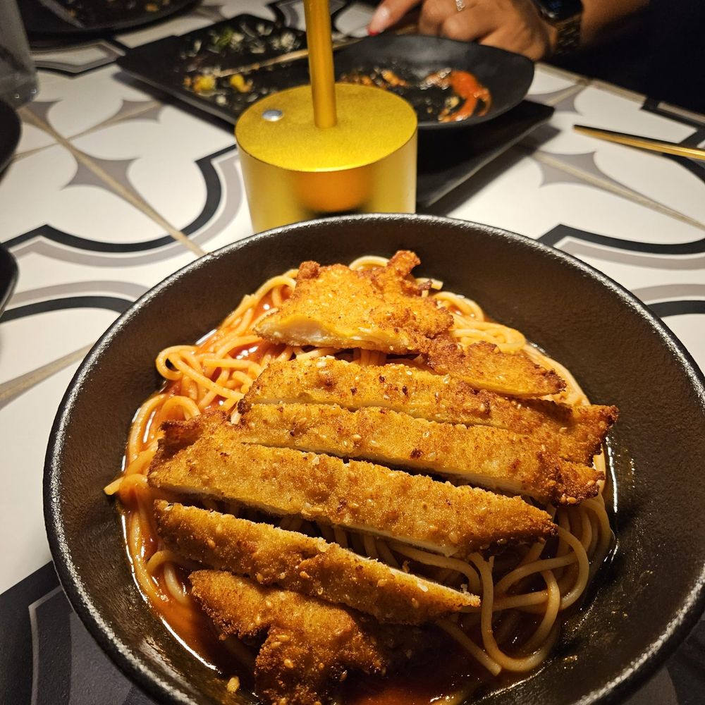Rosalia's Kitchen - Vermicelli with marinara topped with fried chicken - Italian Near Me - Miramar, Florida Rosalia's Kitchen - Vermicelli with marinara topped with fried chicken - Italian Near Me - Miramar, Florida