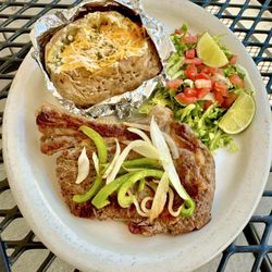Rib-eye steak with baked potato Address