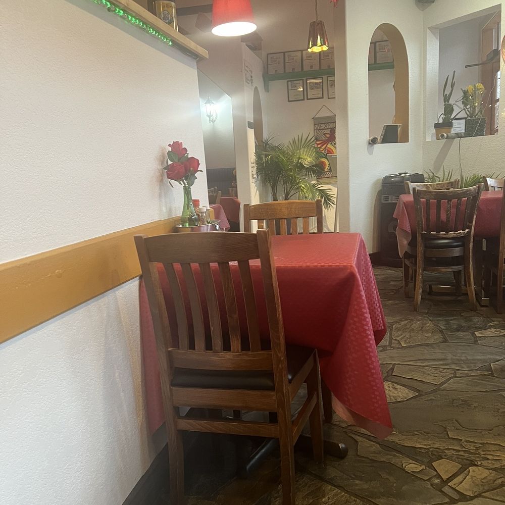 Hector's Casa - a table and chairs in a restaurant - Mexican Near Me - Kelowna, British Columbia Hector's Casa - a table and chairs in a restaurant - Mexican Near Me - Kelowna, British Columbia